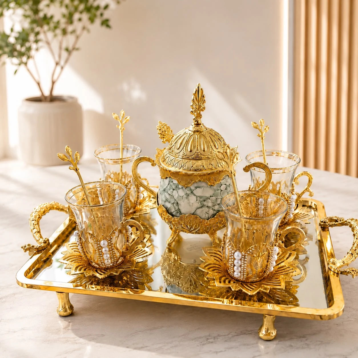 Juego de té para cuatro Perlas; Juego de té para cuatro Perlas con detalles visibles que realzan su presencia en la mesa o el hogar