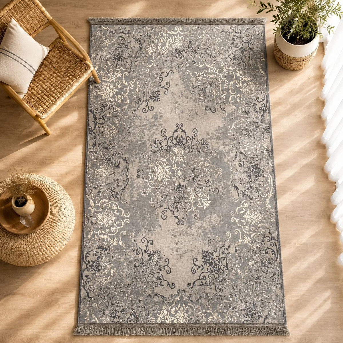 alfombra Aquaclean con diseño arabesco en tonos grises